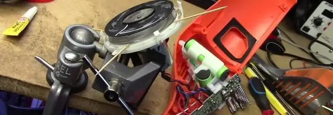 Vacuum cleaner repair parts and tools on a workbench in Louisville, KY